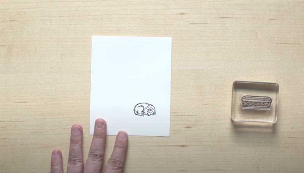 Start by placing the stamp image in the foreground on your piece of paper. 