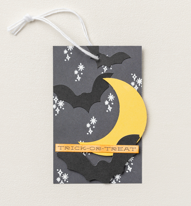 Or how about using a simpler paper design to help your crescent moon POP?! Add a “trick or treat” message along with bat silhouettes, and you’ve got a tag that absolutely OOZES Halloween.