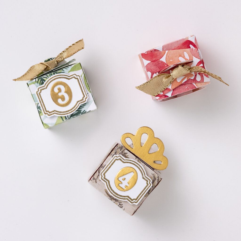 Even though the materials used to make these boxes have been retired, you can use them for inspiration. Mini gifts numbered and adorned with festive ribbon are the perfect way to unwrap something extra delicious each day leading up to Christmas.