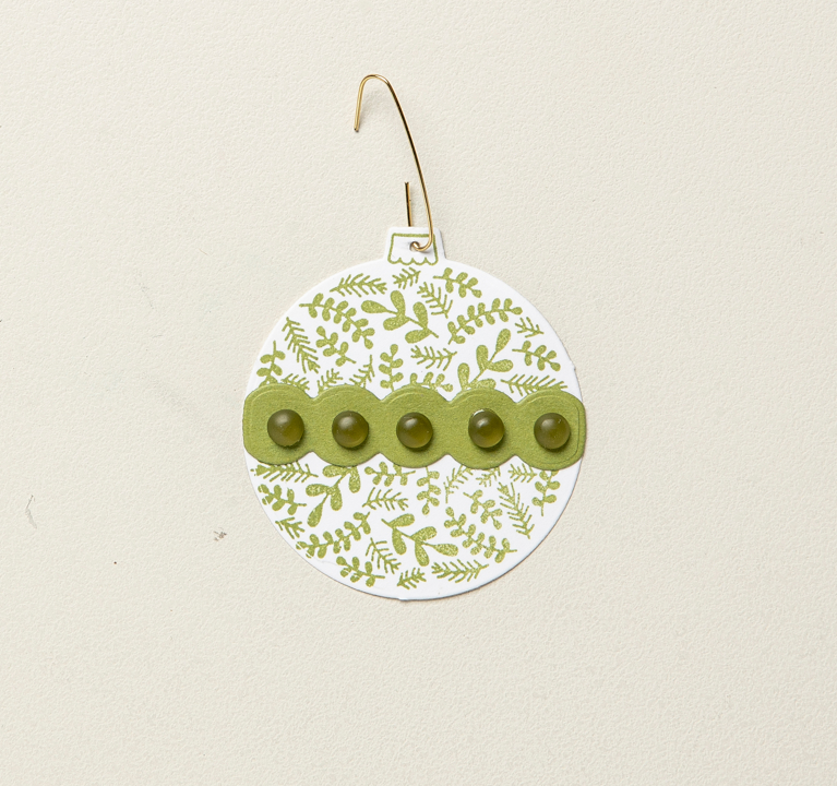 Sometimes the simplest design is the most impactful. This ornament can be created in any number of Christmas colors to match your tree and decor. It uses the included die cut and stamps, as well as some additional fun embellishments to complete the look.