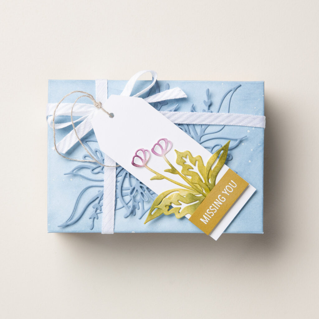 Using a design by Stampin' Up!, you can create beautiful DIY paper box for gifts like the one featured here.