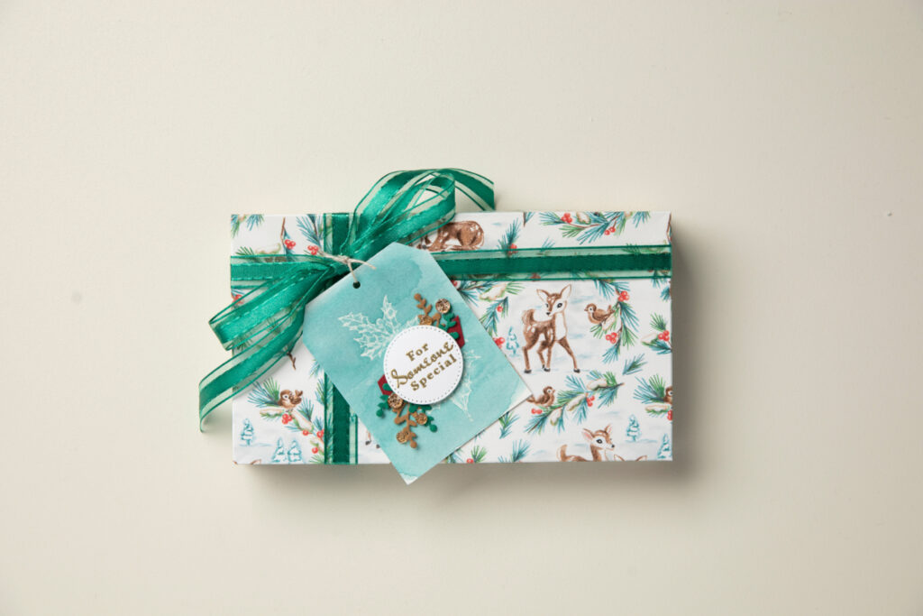 We used Christmas patterned paper as wrapping paper for a small gift and made a coordinating tag!