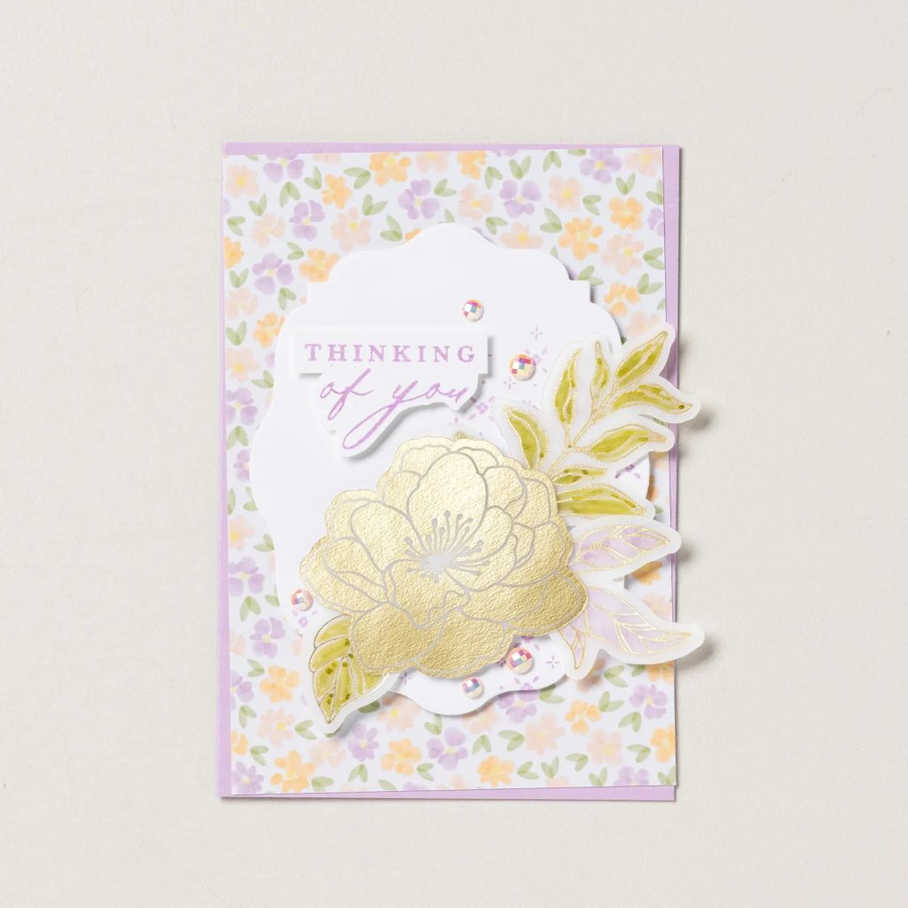 Handmade floral greeting card featuring pearlized faceted circle embellishments, decorative ribbon, layered circles, and stamped floral artwork.
