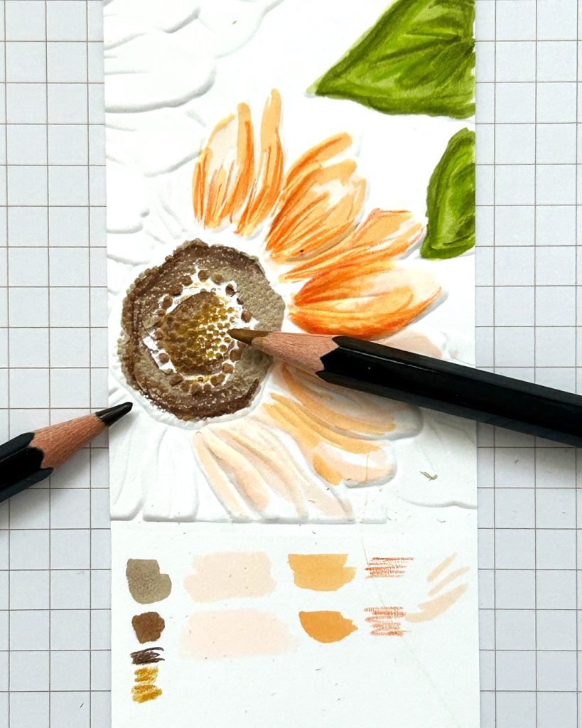 Once your project is dry, it’s time to use your colored pencils to highlight the texture of your pattern by adding fine details and highlights. Use your color swatch for reference. Crafters often use a white colored pencil to highlight specific details.