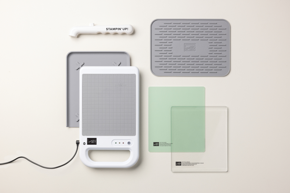 Here’s what to expect in The Stampin’ Hot Foil System: Stampin’ Hot Foil platform, silicone platform station, green Hot Foil Shim, clear Hot Foil Spacer, silicone cooling pad for hot dies, Magnetic Pick-Up Tool, power cord, and detailed instructions.