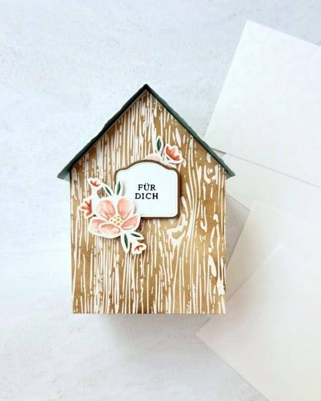 House-shaped handmade card with woodgrain paper and peach floral embellishments