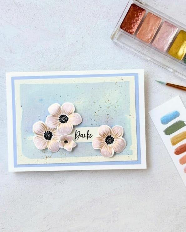Handmade floral thank-you card with a soft blue watercolor background and dimensional flowers