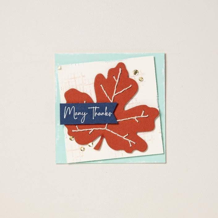 Handmade greeting card featuring a large rust-colored paper leaf, white stitched-style details, and a Many Thanks sentiment